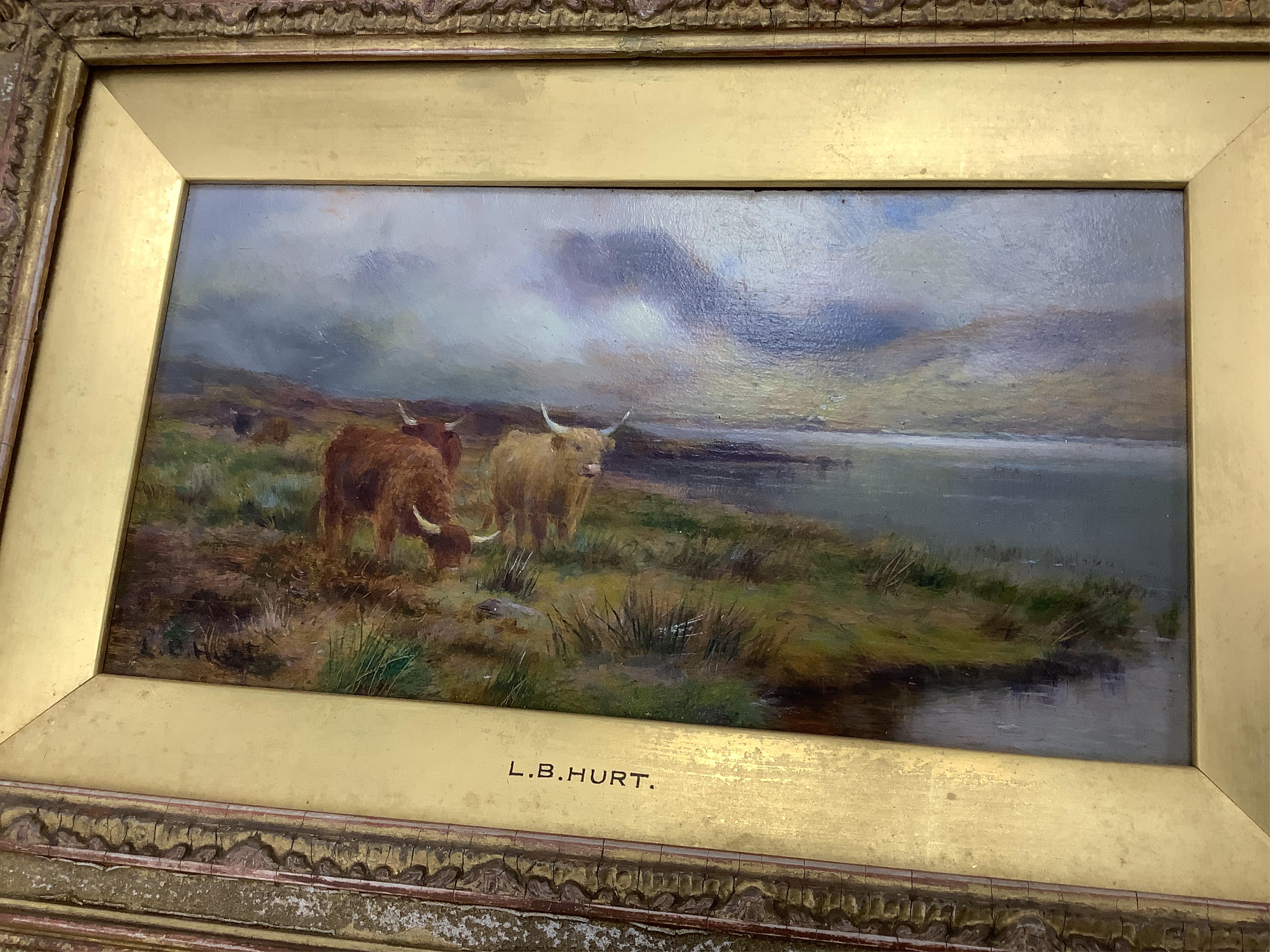 Louis Bosworth Hurt (1856-1929), Highland cattle by a loch, signed, oil on board, 12 x 23cm